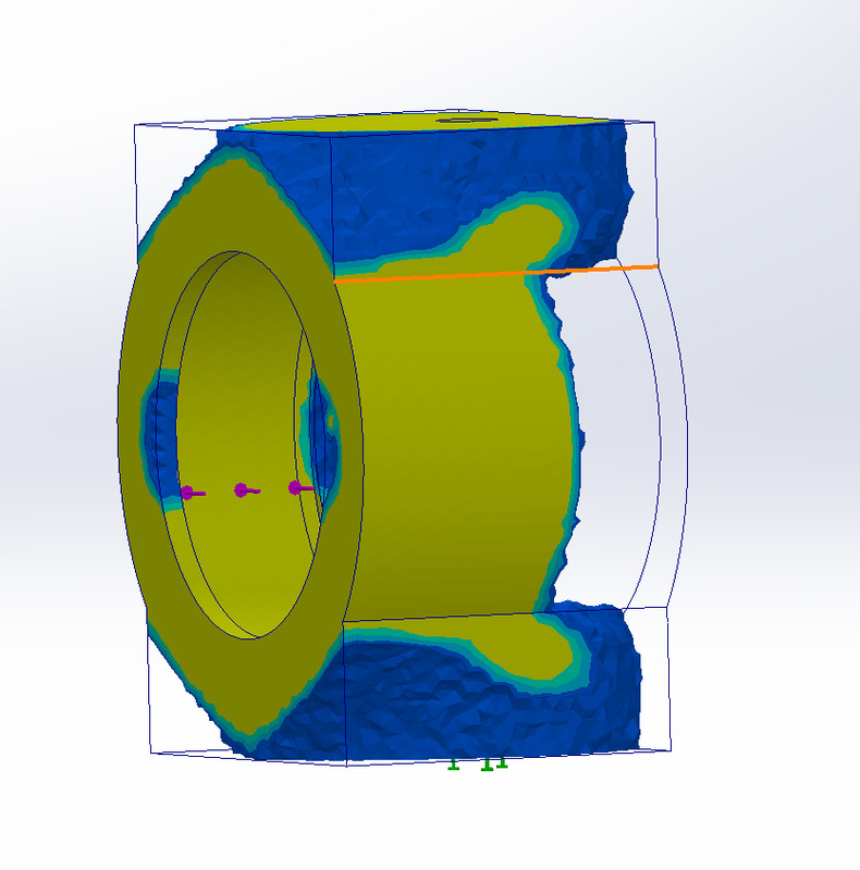 Second view of the SolidWorks Simulation stress plot of the cylindrical housing with a bore; no legend shown