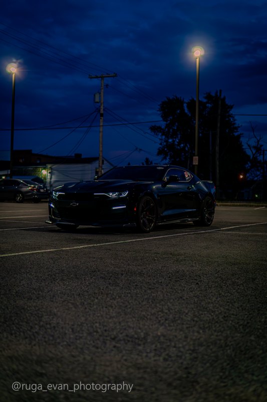 Black Camaro at dusk
