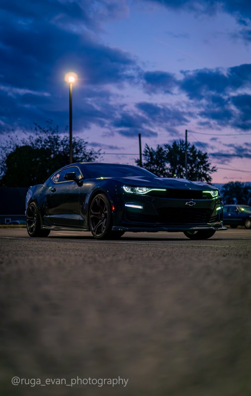 Black Camaro at dusk
