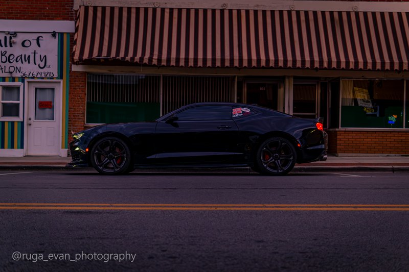 Black Camaro at dusk