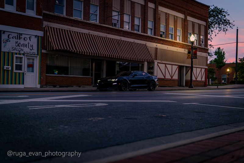 Black Camaro at dusk