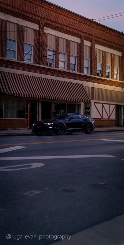 Black Camaro at dusk