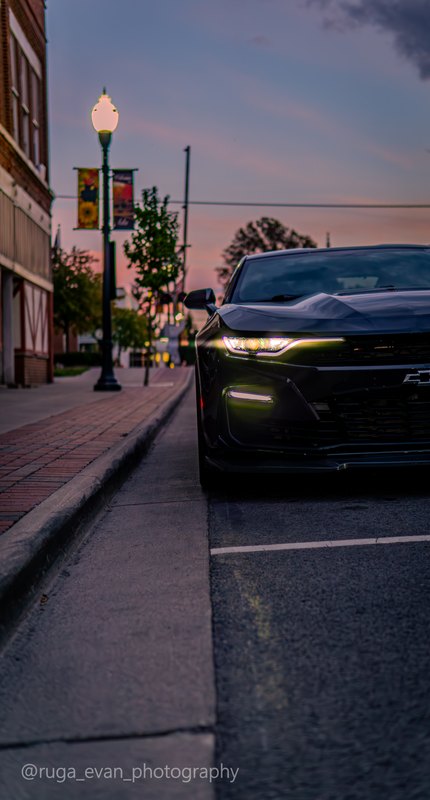 Black Camaro at dusk