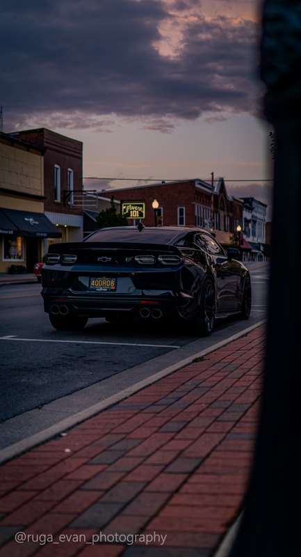 Black Camaro at dusk