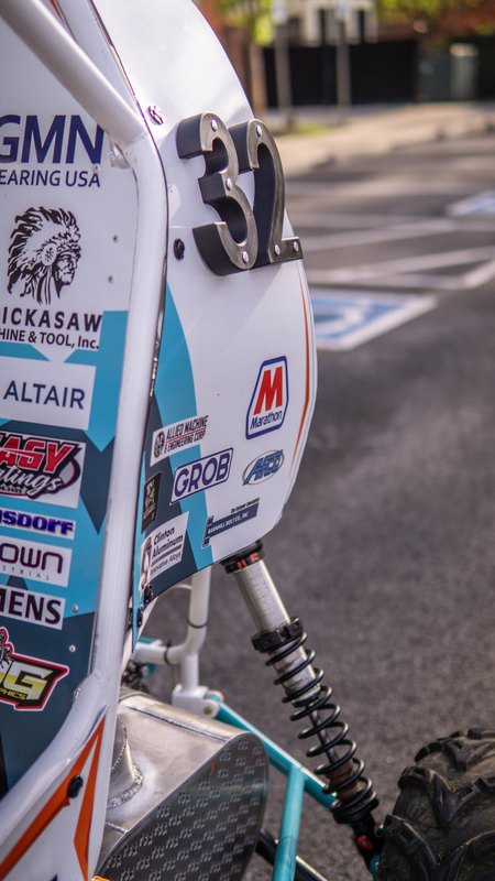 Close-up of the number 32 and sponsor decals on the side panel