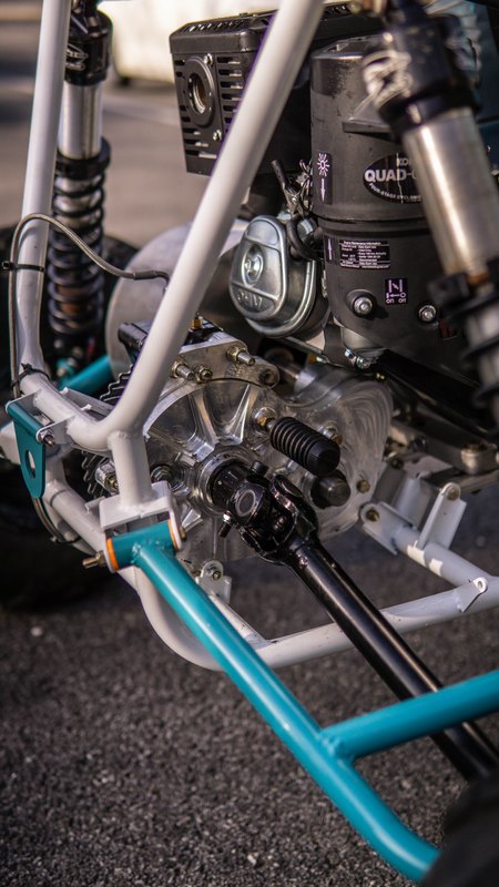 ONU Baja SAE car number 32, white bodywork and teal frame, at its reveal shoot